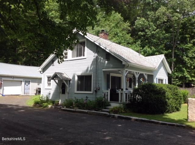 83 Town Hill Road Middlefield, MA 01235 - Photo 1 of 17 a view of a white house next to a yard with potted plants