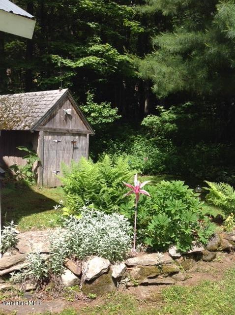 83 Town Hill Road Middlefield, MA 01235 - Photo 15 of 17 a front view of a house with a yard