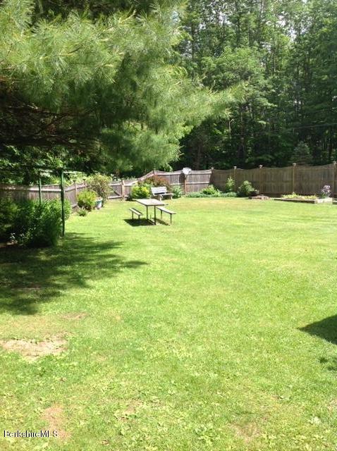 83 Town Hill Road Middlefield, MA 01235 - Photo 16 of 17 a swimming pool with trees in the background