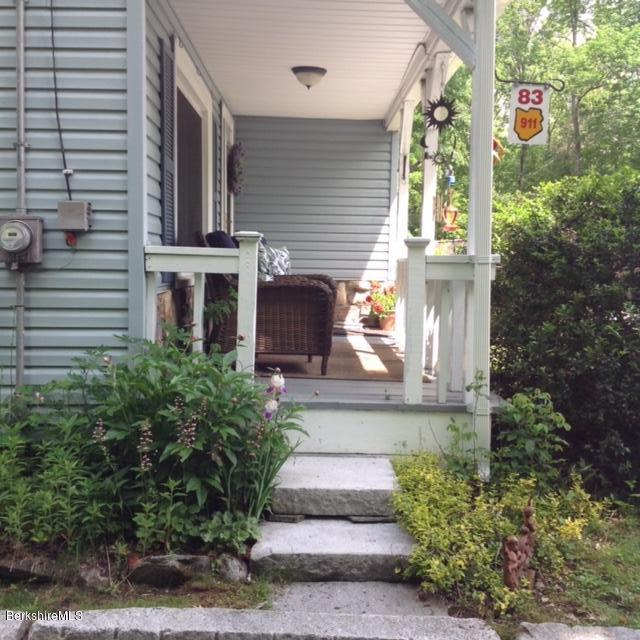 83 Town Hill Road Middlefield, MA 01235 - Photo 3 of 17 a front view of a house with a yard
