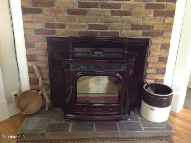 83 Town Hill Road Middlefield, MA 01235 - Photo 10 of 17 a close view of a fireplace and wooden floor