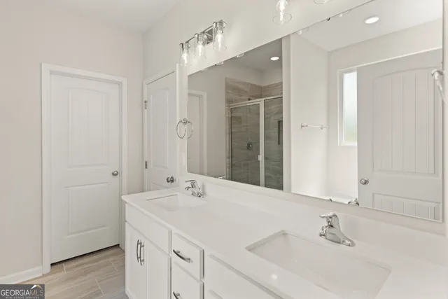 a bathroom with a sink and a mirror