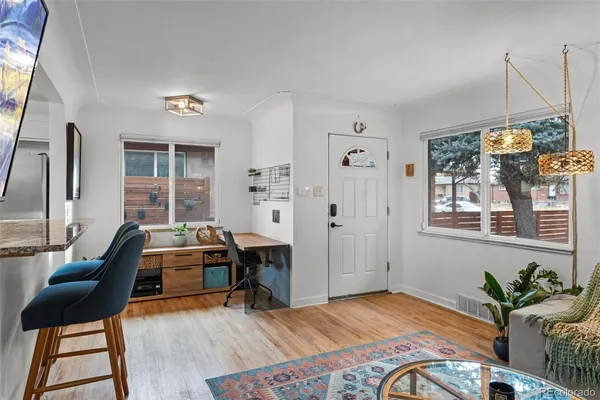a bedroom with furniture and a window