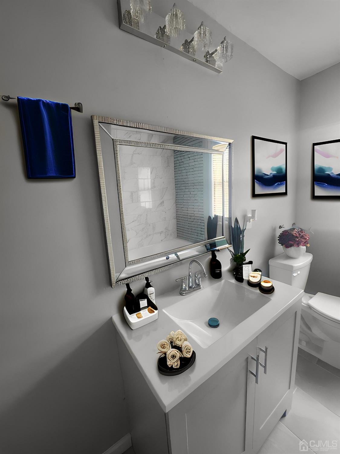 190 Berkeley Terrace Plainfield, NJ 07062 - Photo 6 of 23 a bathroom with a sink and a mirror