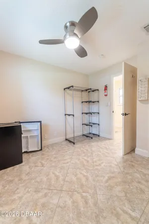 a view of a room with gym equipment and windows