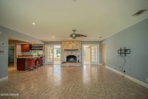 a living room with furniture a fireplace and a fireplace