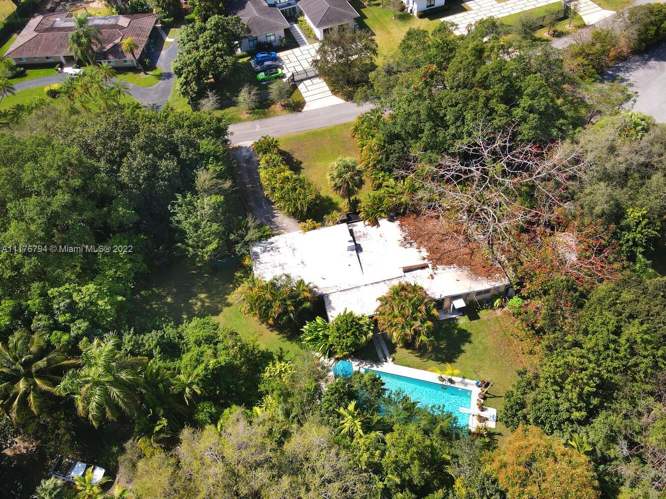 11301 Southwest 80th Road Pinecrest, FL 33156 - Photo 3 of 15 a view of a garden