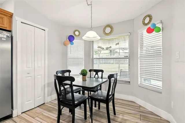 a dining room with furniture and window