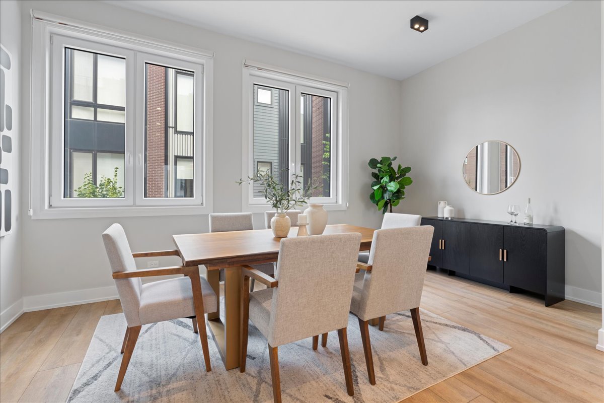 4232 West Belmont Avenue, Unit 2 Chicago, IL 60641 - Photo 13 of 35 a view of a dining room with furniture window and wooden floor