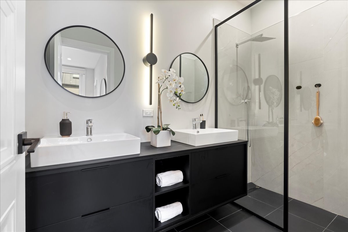 4232 West Belmont Avenue, Unit 2 Chicago, IL 60641 - Photo 18 of 35 a bathroom with a sink and a mirror