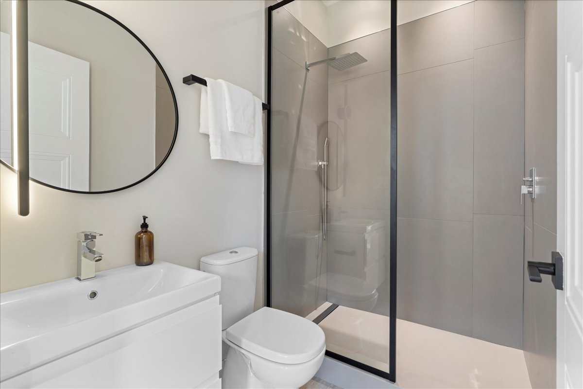 4232 West Belmont Avenue, Unit 2 Chicago, IL 60641 - Photo 26 of 35 a bathroom with a sink toilet and shower