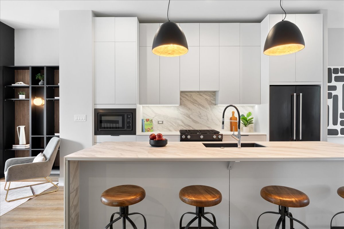4232 West Belmont Avenue, Unit 2 Chicago, IL 60641 - Photo 10 of 35 a kitchen with dining table and chairs