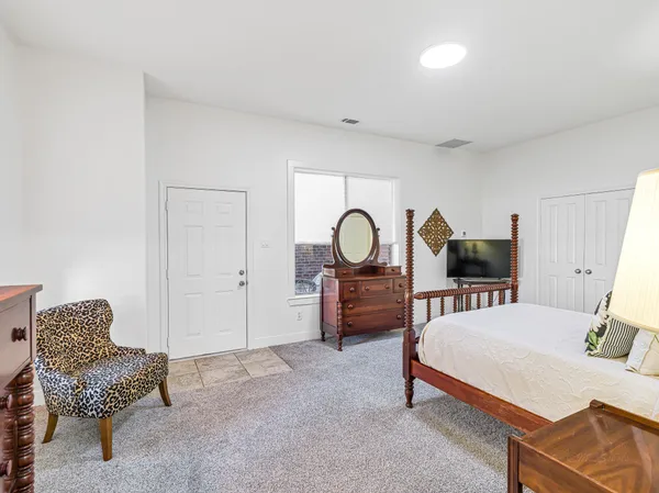 an empty room with wooden floor and a window