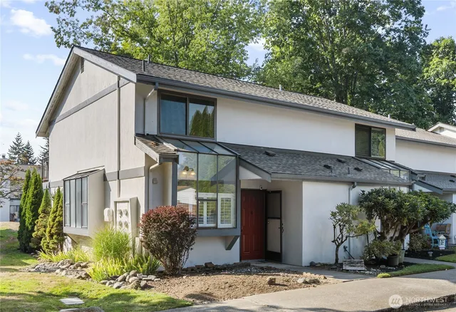 a front view of a house with garden