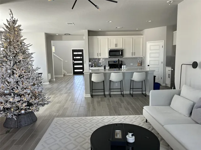 a view of a livingroom with furniture and window