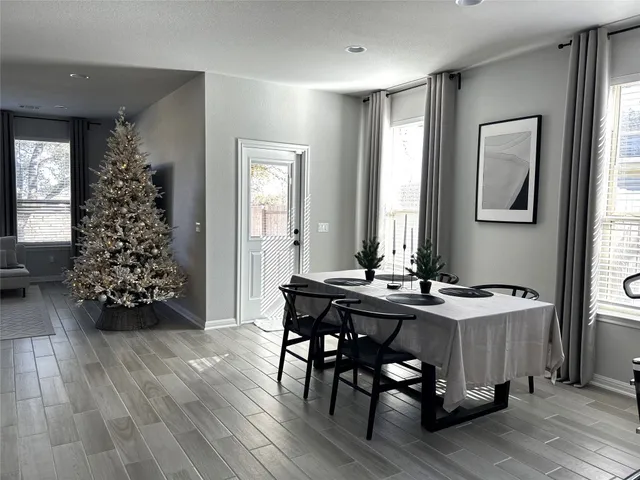 a view of living room with furniture and a large window