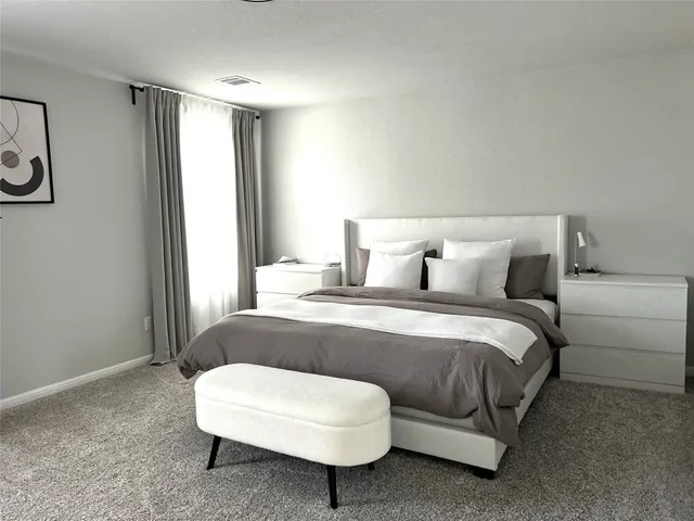 a bathroom with a sink double vanity and a mirror