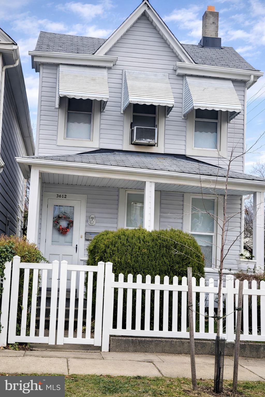 3612 6th Street Baltimore, MD 21225 - Photo 1 of 5 a front view of a house with a garden