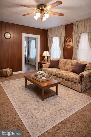 a living room with furniture and a rug