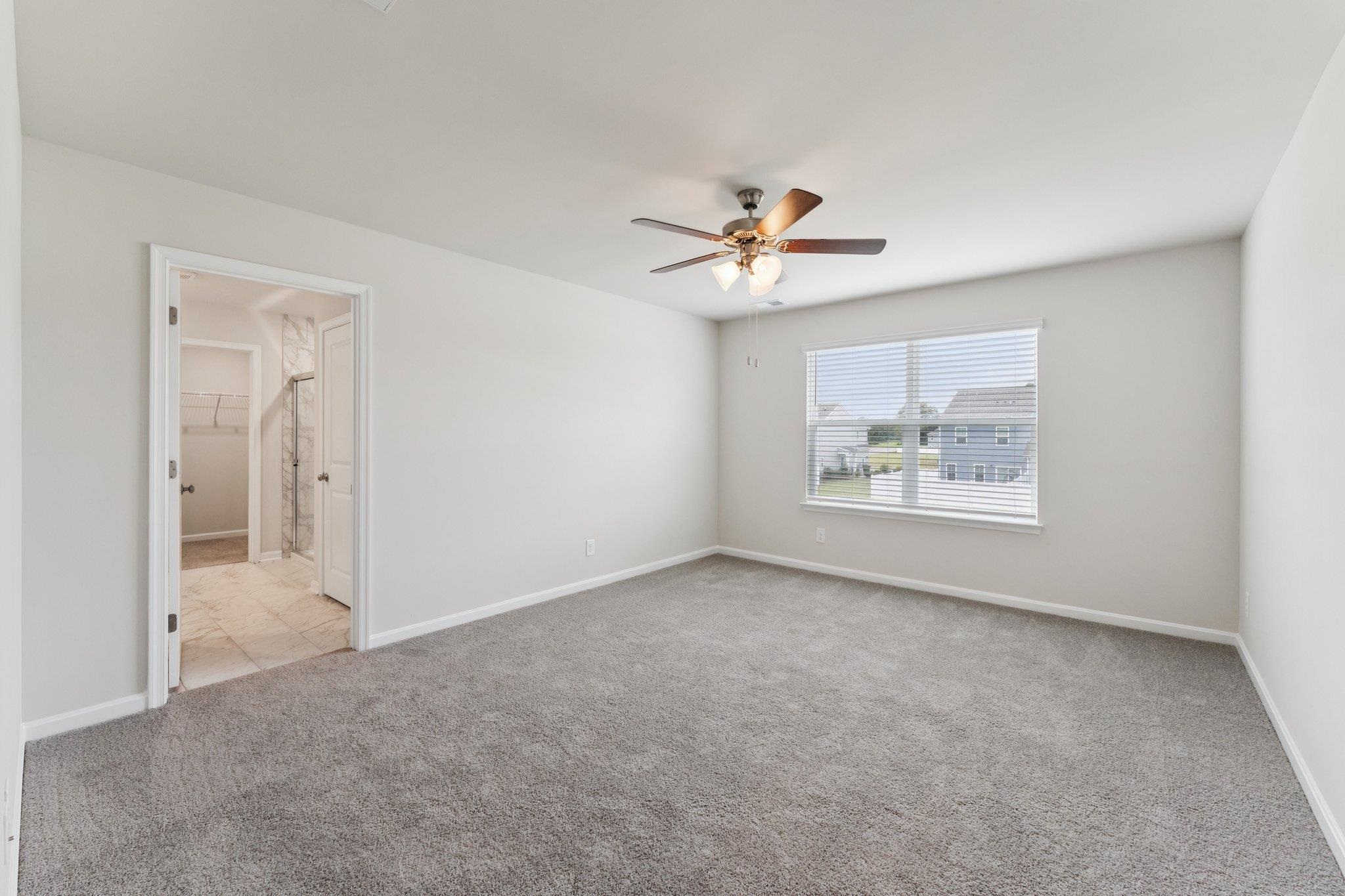 120 Meadow Ridge Way Staunton, VA 24401 - Photo 21 of 33 an empty room with windows and ceiling fan