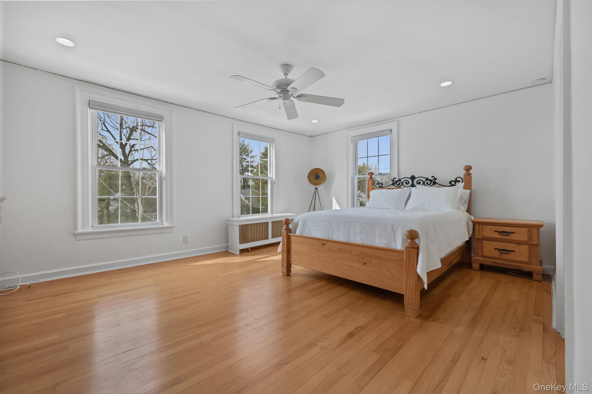 401 Heathcote Road Scarsdale, NY 10583 - Photo 20 of 41 a bedroom with a bed and a table