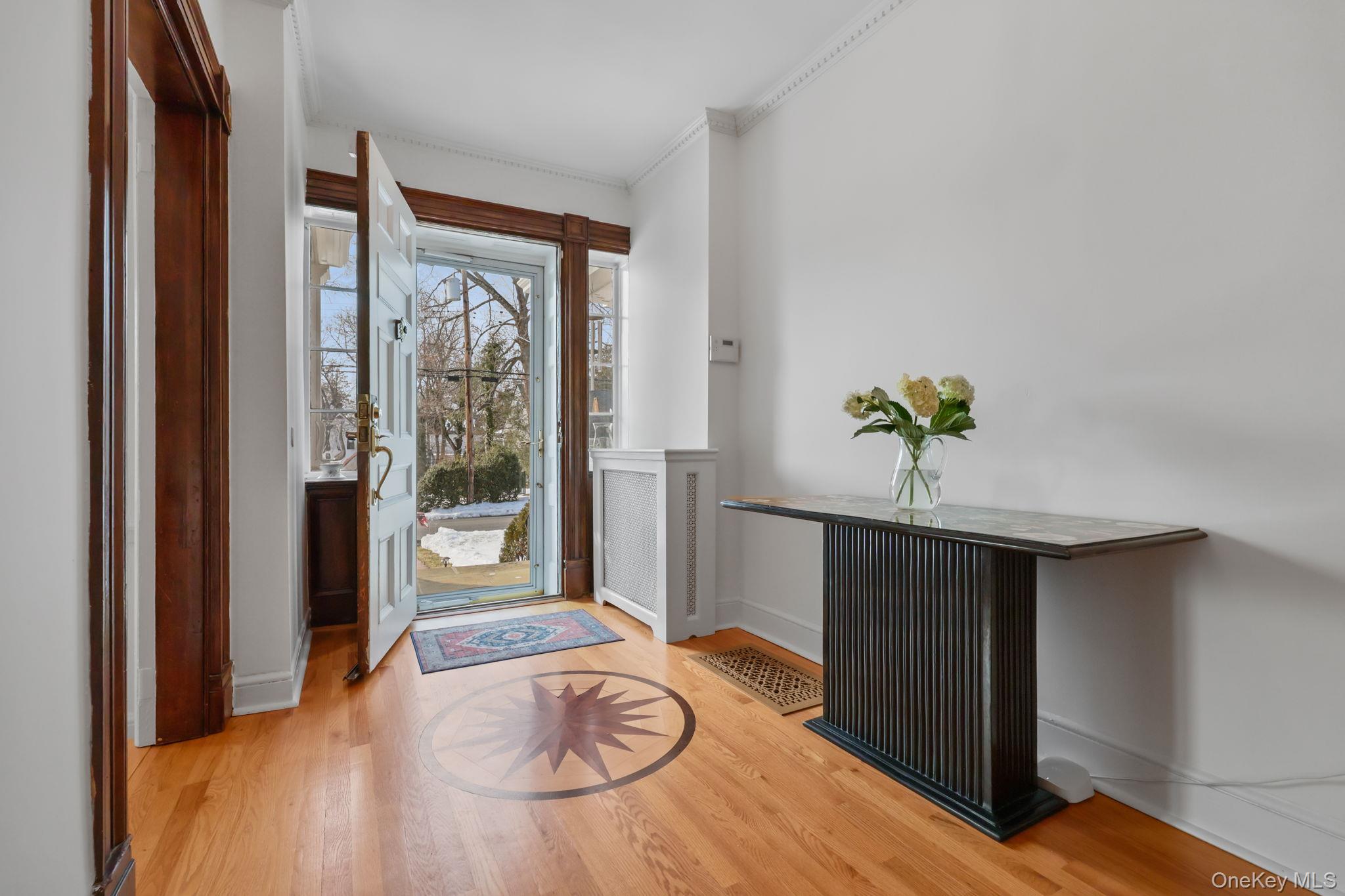 401 Heathcote Road Scarsdale, NY 10583 - Photo 3 of 41 a view of a livingroom with furniture wooden floor and front door