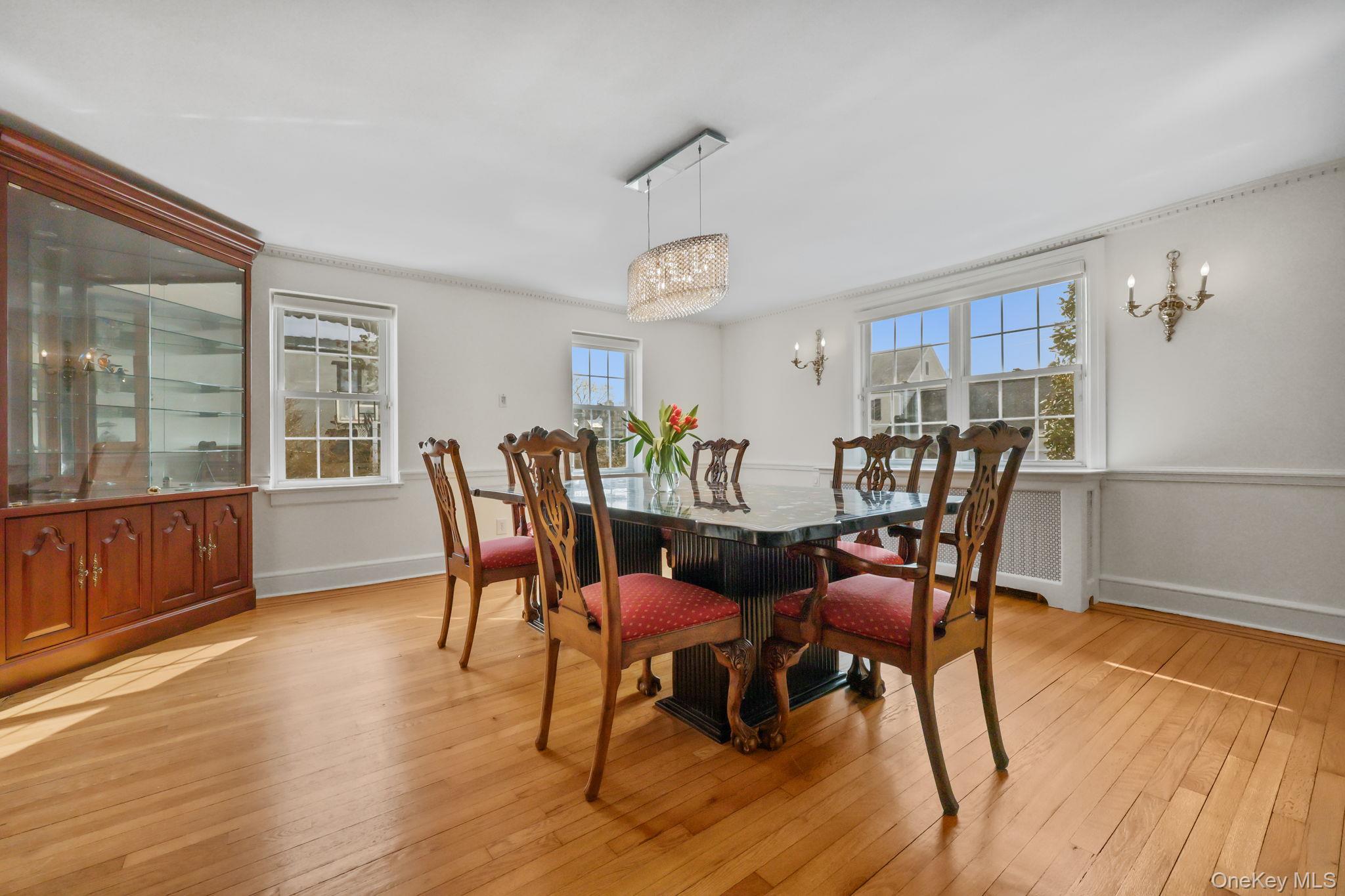 401 Heathcote Road Scarsdale, NY 10583 - Photo 9 of 41 a view of a dining room with furniture and wooden floor