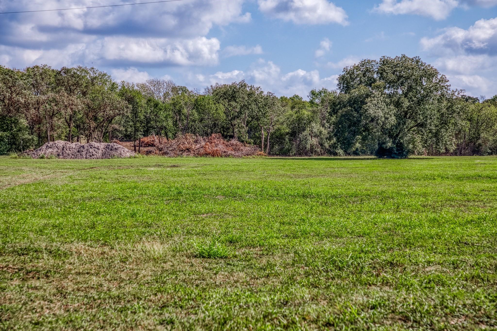 0 Sun Oil Road Brenham, TX 77833 - Photo 5 of 26 a view of a big yard with a house in the background