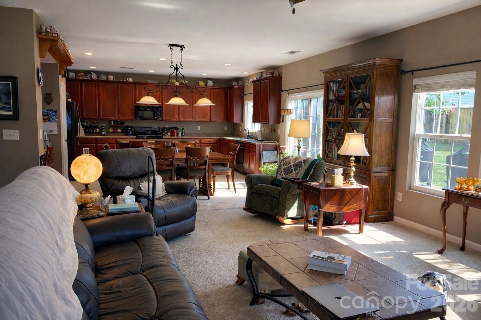 6639 Ruth Ferrell Court Charlotte, NC 28269 - Photo 13 of 30 a living room with furniture and a chandelier