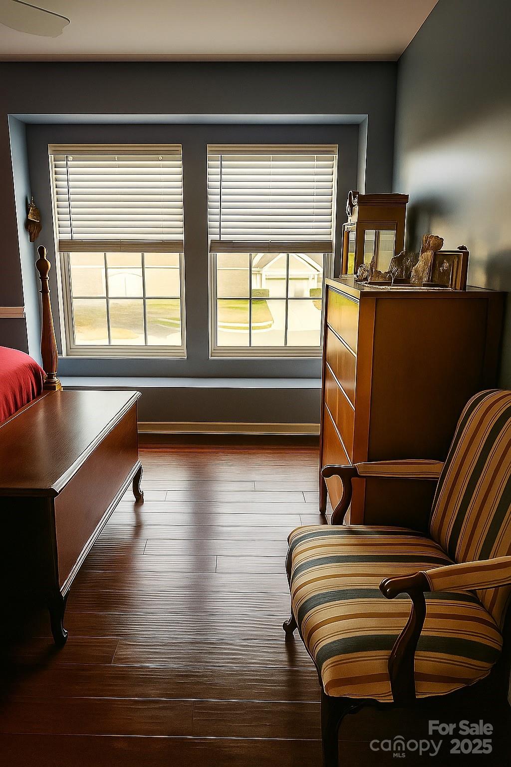 6639 Ruth Ferrell Court Charlotte, NC 28269 - Photo 19 of 27 a room with wooden floor and furniture