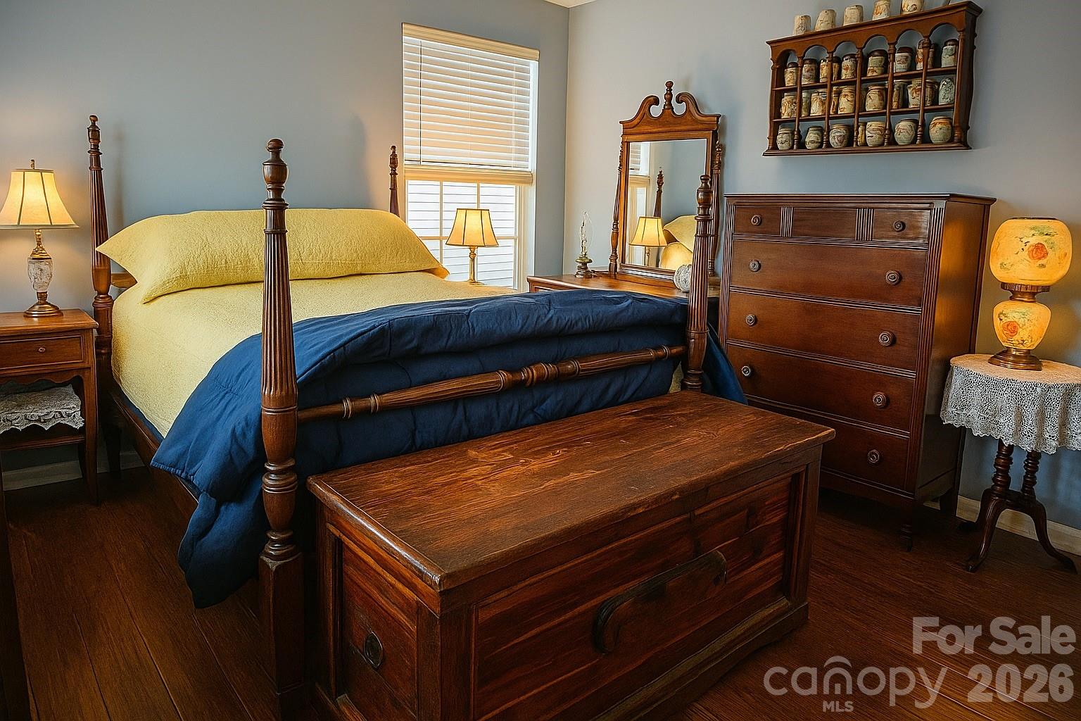 6639 Ruth Ferrell Court Charlotte, NC 28269 - Photo 19 of 30 a bedroom with a bed and wooden floor