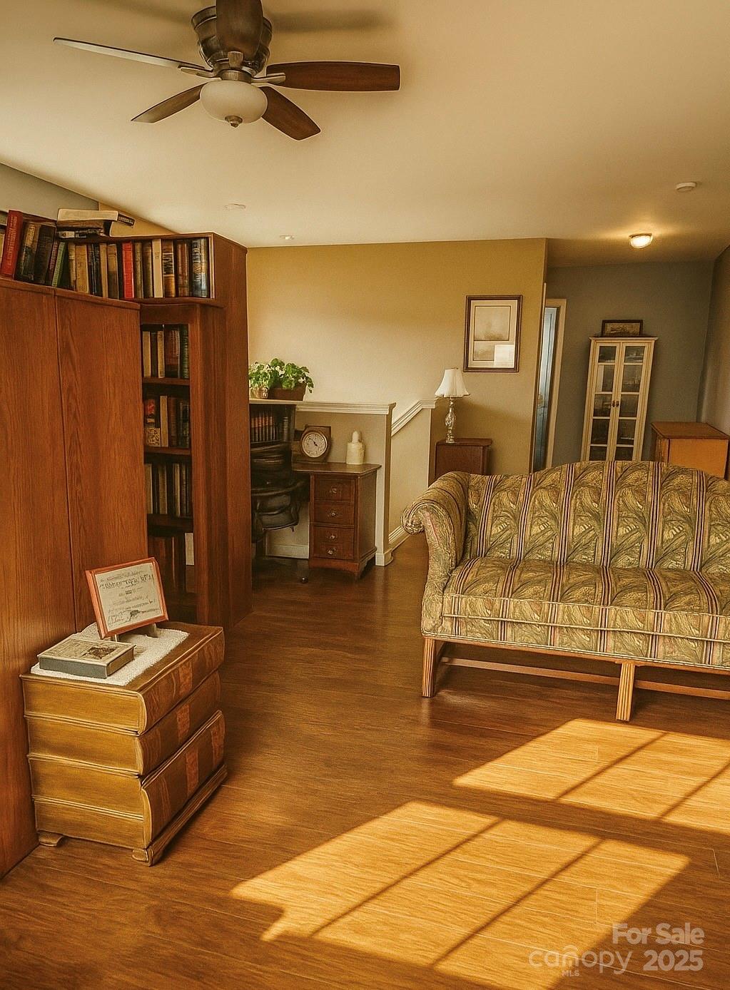 6639 Ruth Ferrell Court Charlotte, NC 28269 - Photo 23 of 27 a bedroom with a bed and wooden floor