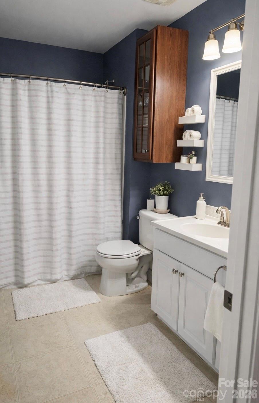 6639 Ruth Ferrell Court Charlotte, NC 28269 - Photo 24 of 30 a bathroom with a sink toilet and shower