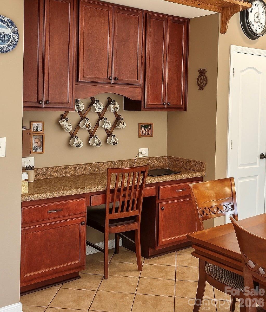 6639 Ruth Ferrell Court Charlotte, NC 28269 - Photo 4 of 30 a kitchen with granite countertop a sink and a cabinets