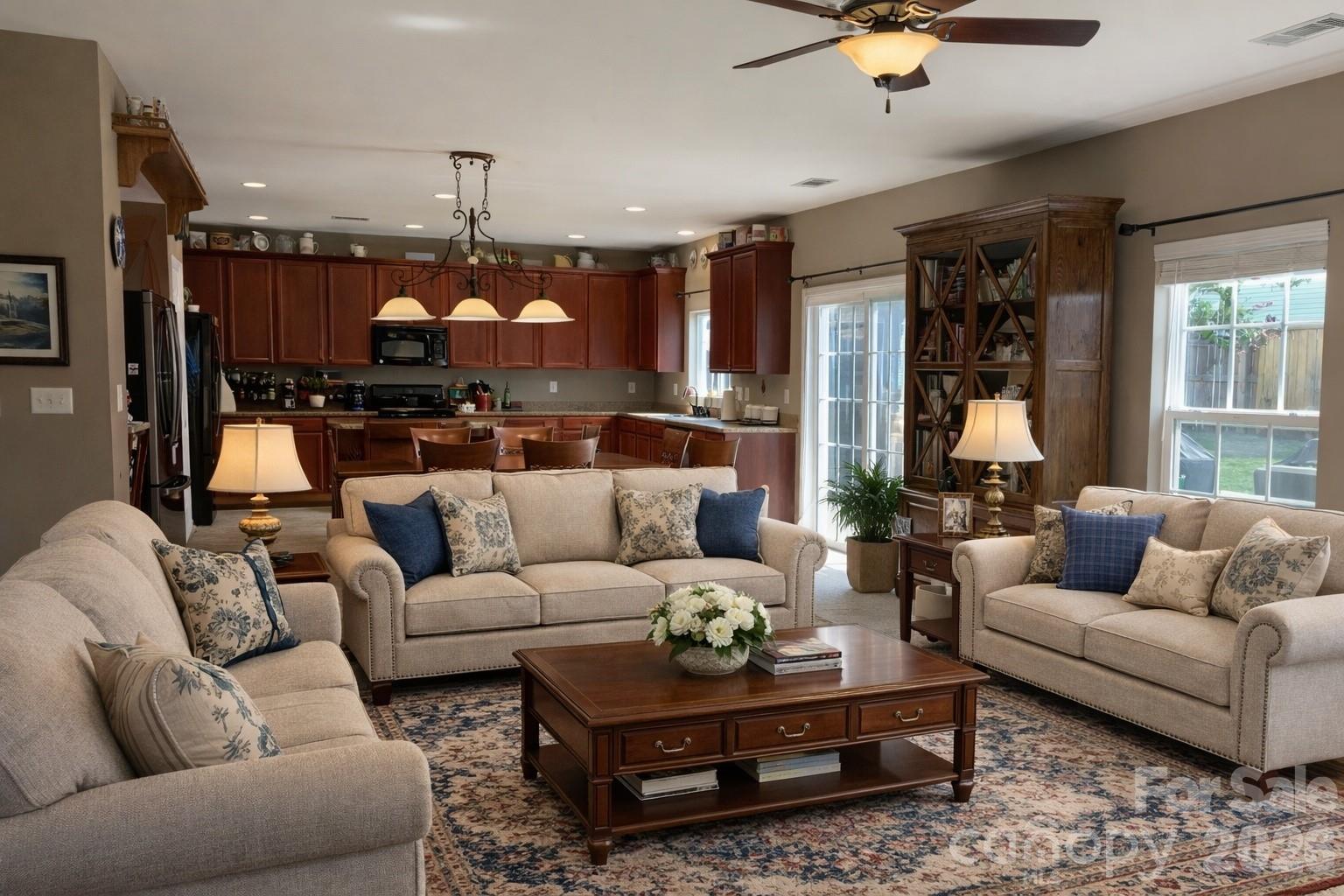 6639 Ruth Ferrell Court Charlotte, NC 28269 - Photo 5 of 30 a living room with furniture fireplace and a chandelier