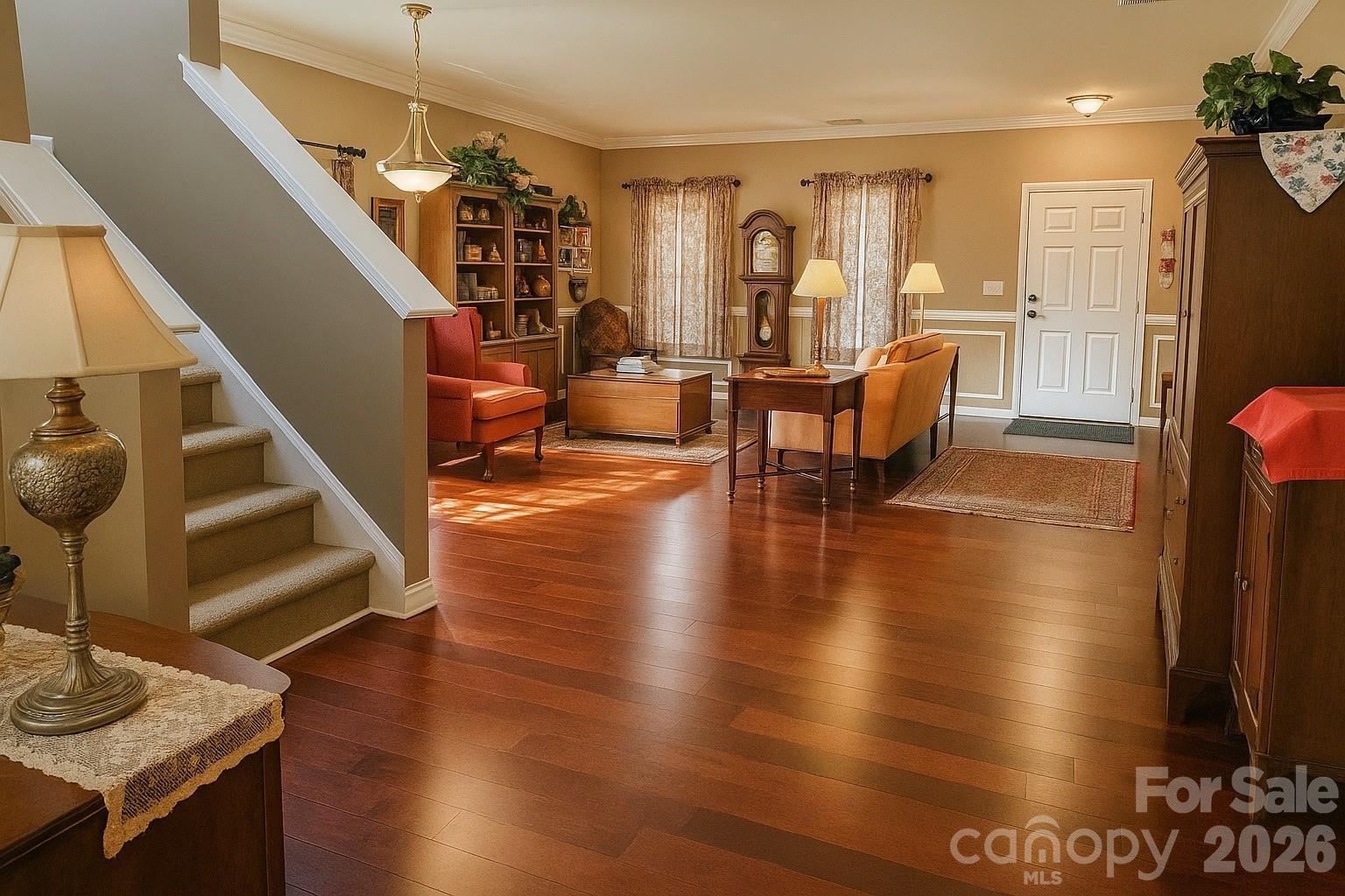6639 Ruth Ferrell Court Charlotte, NC 28269 - Photo 7 of 30 a living room with couches chairs and kitchen view with wooden floor