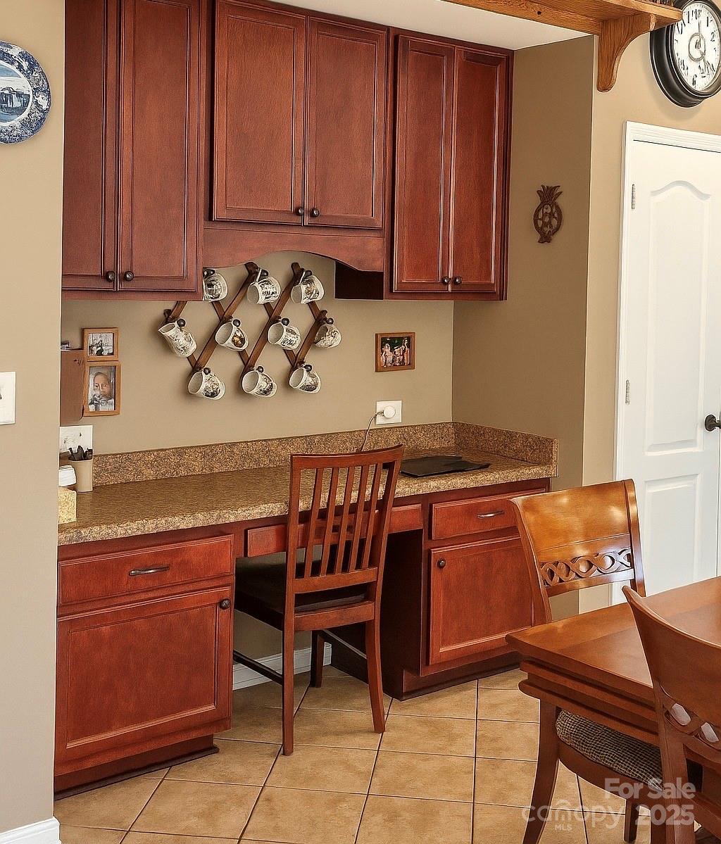 6639 Ruth Ferrell Court Charlotte, NC 28269 - Photo 8 of 27 a kitchen with granite countertop a sink and a cabinets