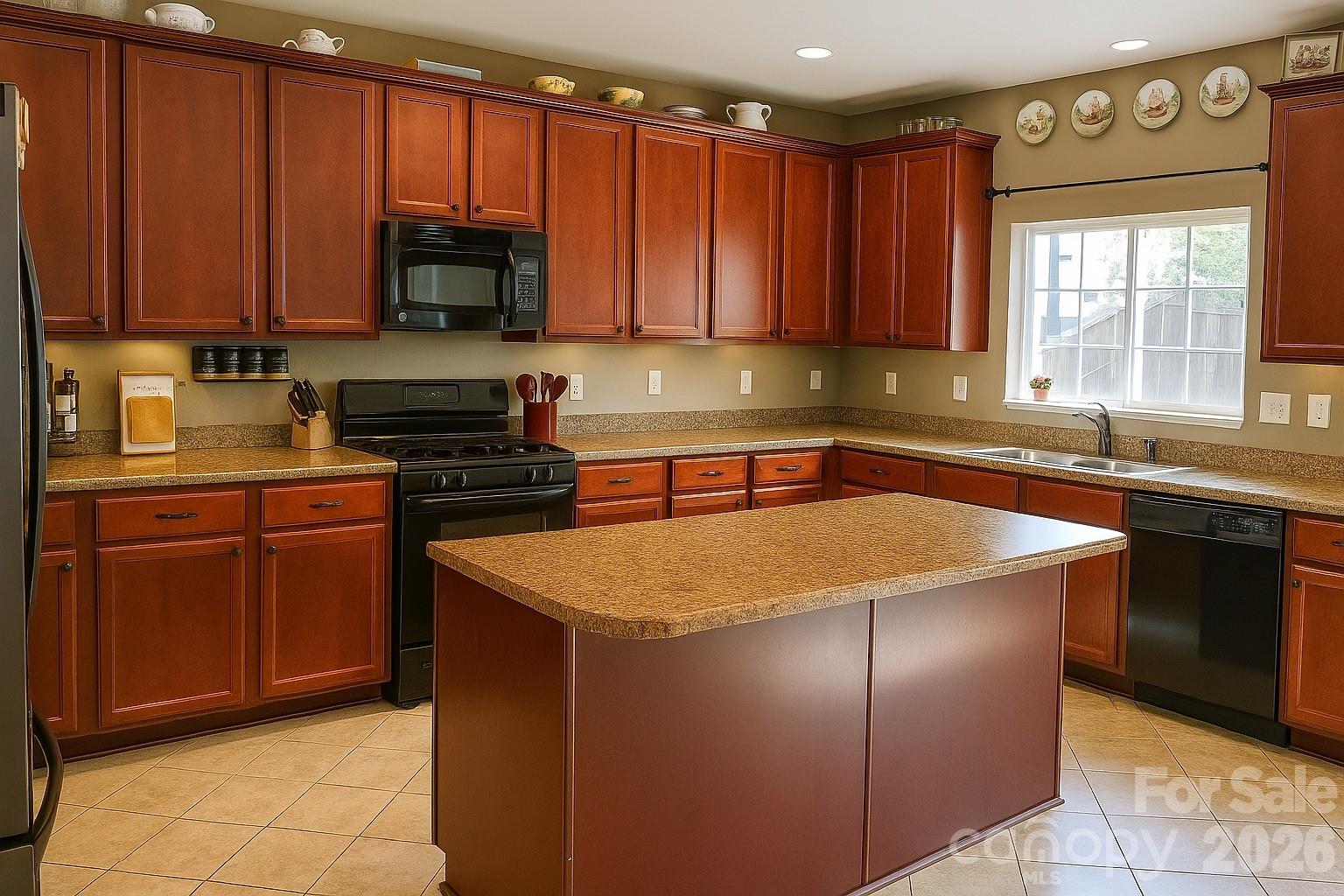 6639 Ruth Ferrell Court Charlotte, NC 28269 - Photo 10 of 30 a kitchen with stainless steel appliances granite countertop a sink stove and microwave