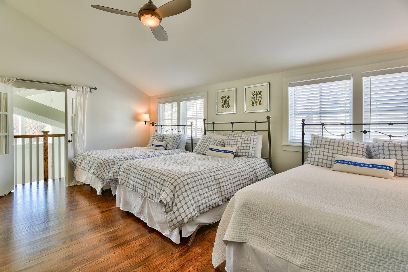 237 Salt Inlet Beach Inlet Beach, FL 32461 - Photo 21 of 28 a bedroom with a large bed and a chandelier