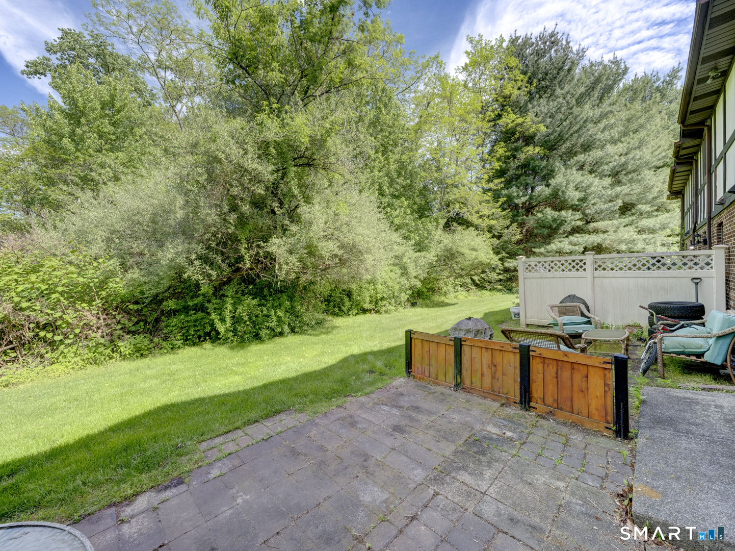 2 Branch Road, Unit 2C Thomaston, CT 06787 - Photo 23 of 26 a view of a backyard with seating area
