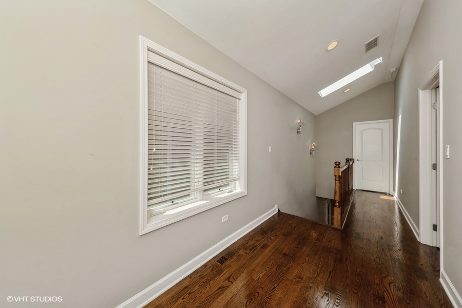 3251 South Normal Avenue Chicago, IL 60616 - Photo 7 of 12 a very nice looking room with wooden floor and a window