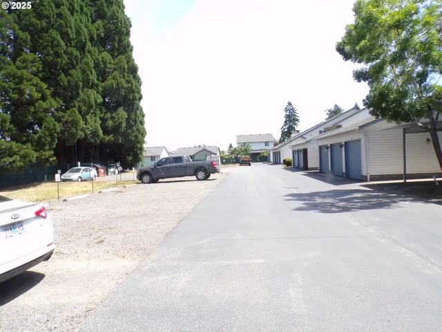 a view of pool with a yard