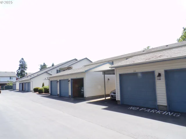 a front view of a house with a garage