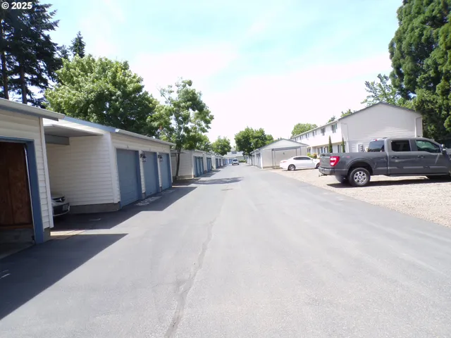 a view of a car parked in front of a house
