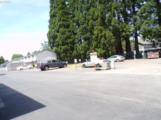 a view of street with a parked cars