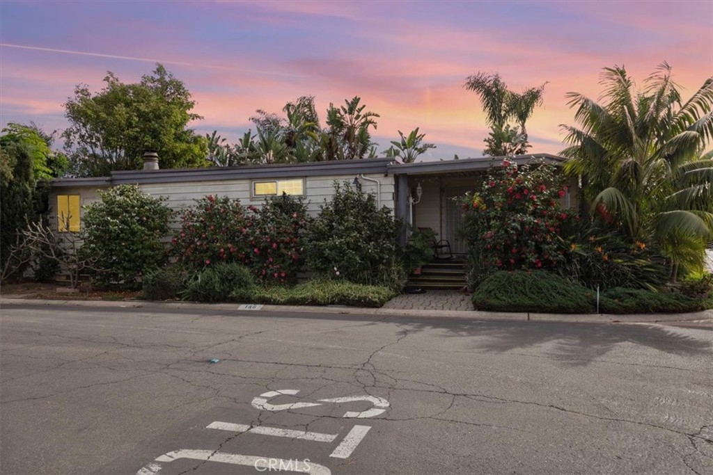 300 North Rampart Street, Unit 158 Orange, CA 92868 - Photo 1 of 31 Corner lot with lush tropical plants