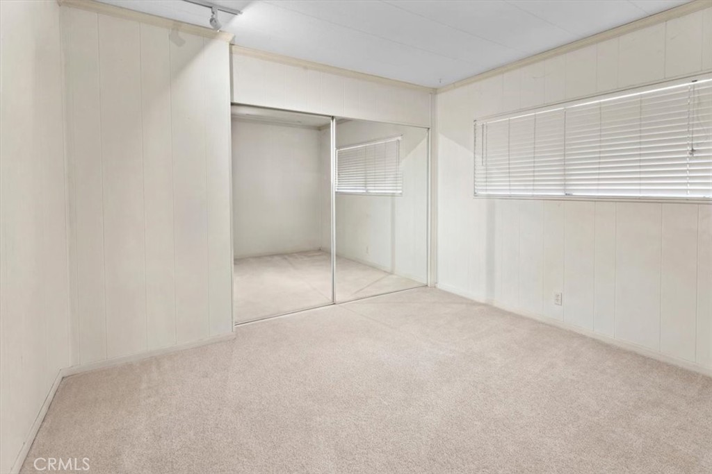 300 North Rampart Street, Unit 158 Orange, CA 92868 - Photo 31 of 31 Additional bedroom with mirrored closet