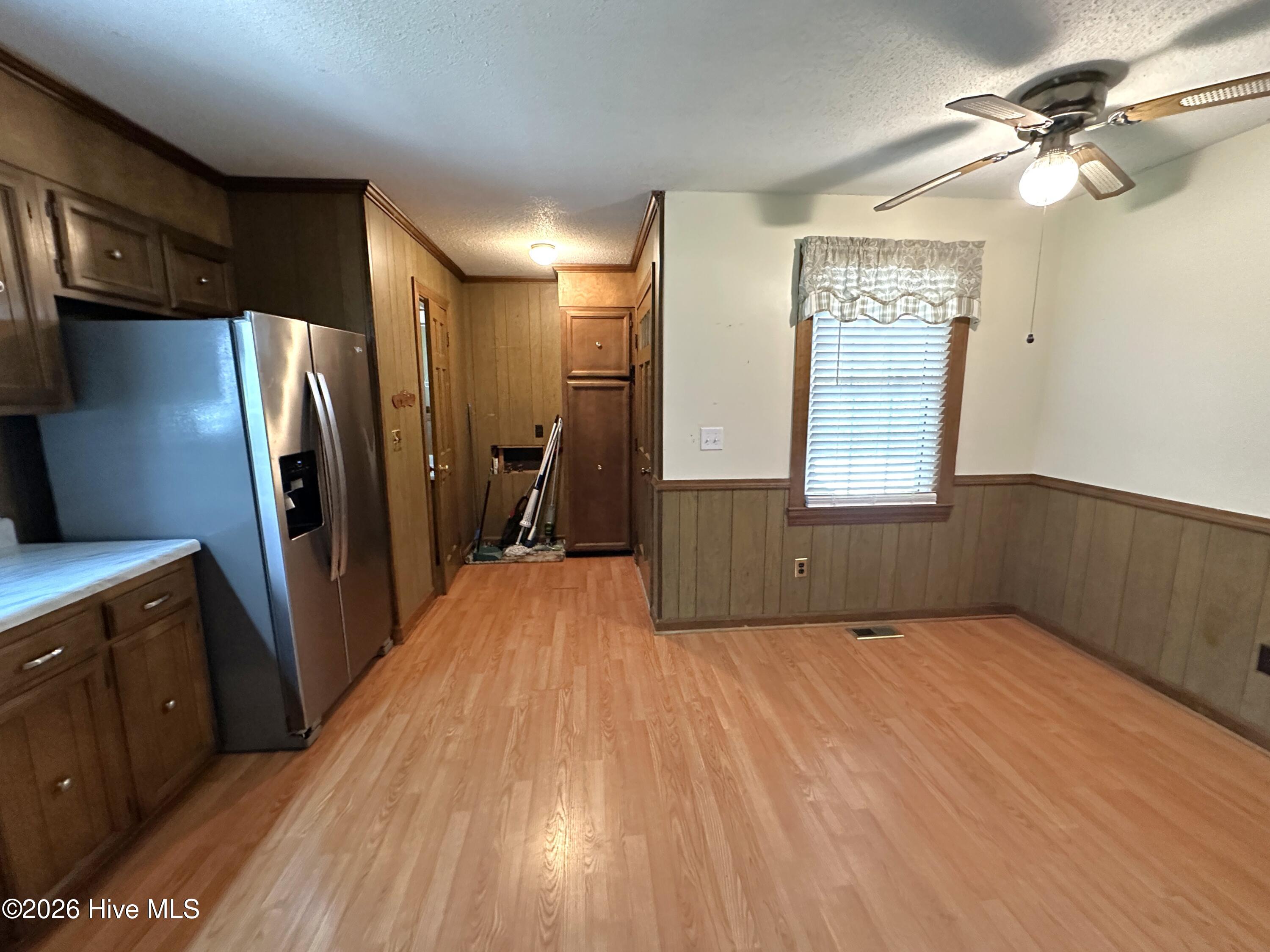 504 Pineview Road Clinton, NC 28328 - Photo 13 of 30 Kitchen dinette, Rough in for stack unit washer/dryer. Carport entry.