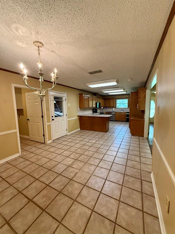 11535 Timber Ridge Drive Keithville, LA 71047 - Photo 39 of 39 a large white kitchen with stainless steel appliances a sink and cabinets