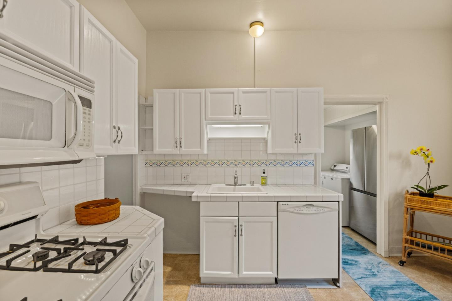 21 Fourth Street Spreckels, CA 93962 - Photo 10 of 31 a kitchen with a sink a stove and refrigerator